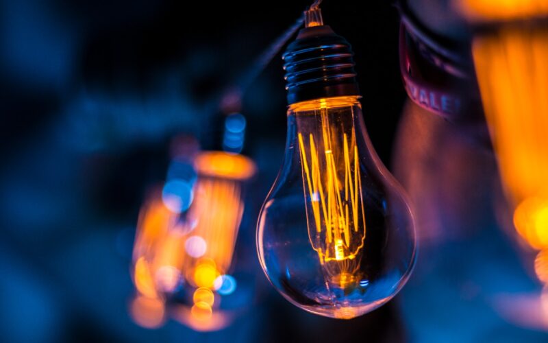 selective focus photography of clear light bulb