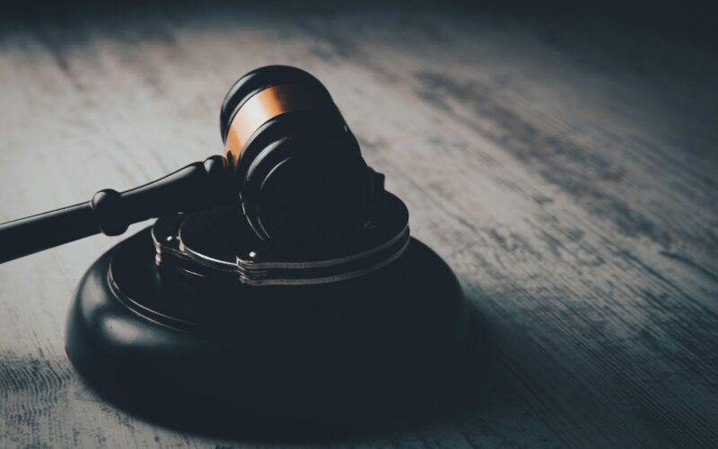 a judge's gaven on a wooden table