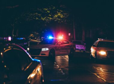 A couple of police cars parked in a parking lot