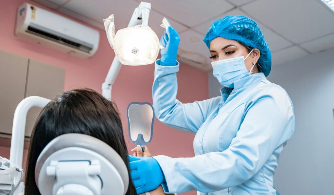 a woman getting her teeth checked by a dentist