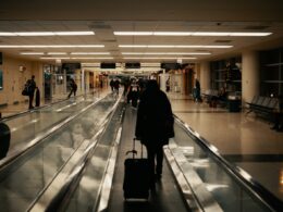 walking man holding luggage