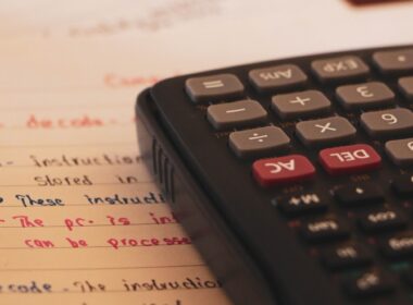 a calculator sitting on top of a piece of paper