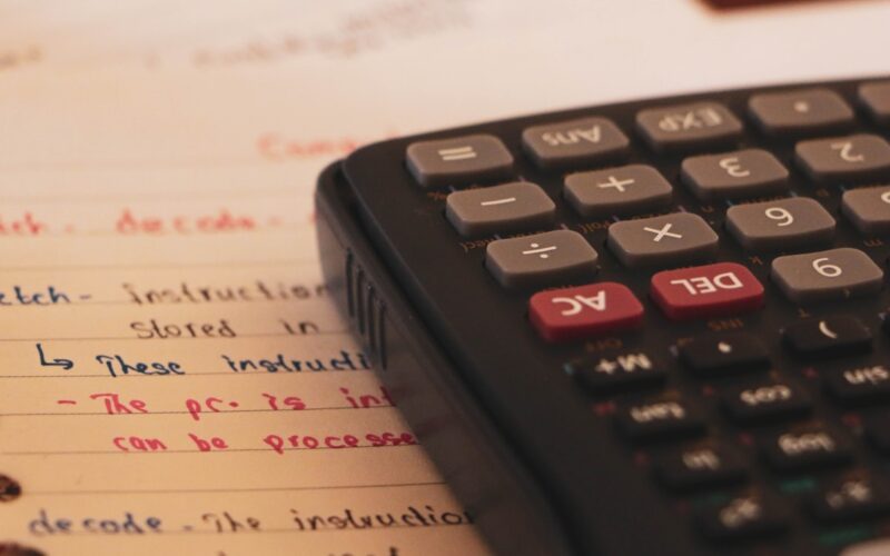 a calculator sitting on top of a piece of paper
