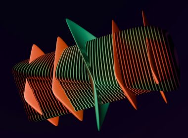 A group of orange and green objects against a black background