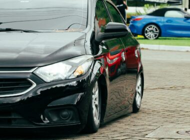 A black car parked on the side of the road