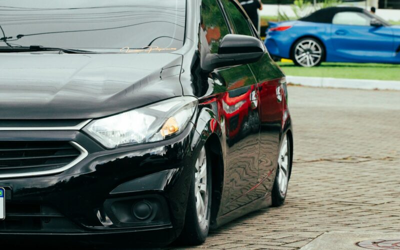A black car parked on the side of the road