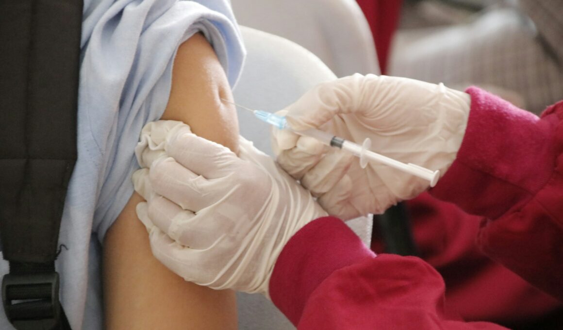a person in a red shirt and white gloves