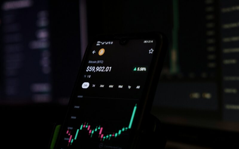 a cell phone displaying a stock chart on the screen
