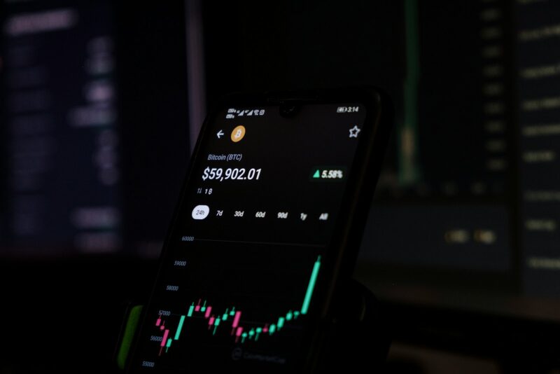 a cell phone displaying a stock chart on the screen