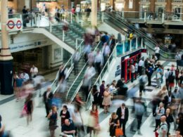 people standing and walking on stairs in mall