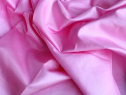 pink textile in close up photography