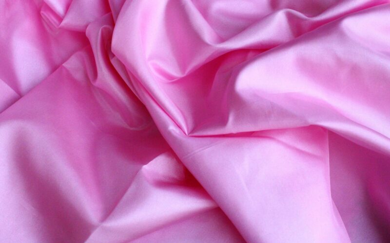 pink textile in close up photography