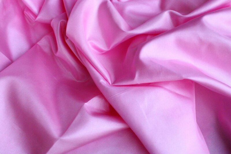 pink textile in close up photography