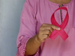 woman in pink and white polka dot shirt